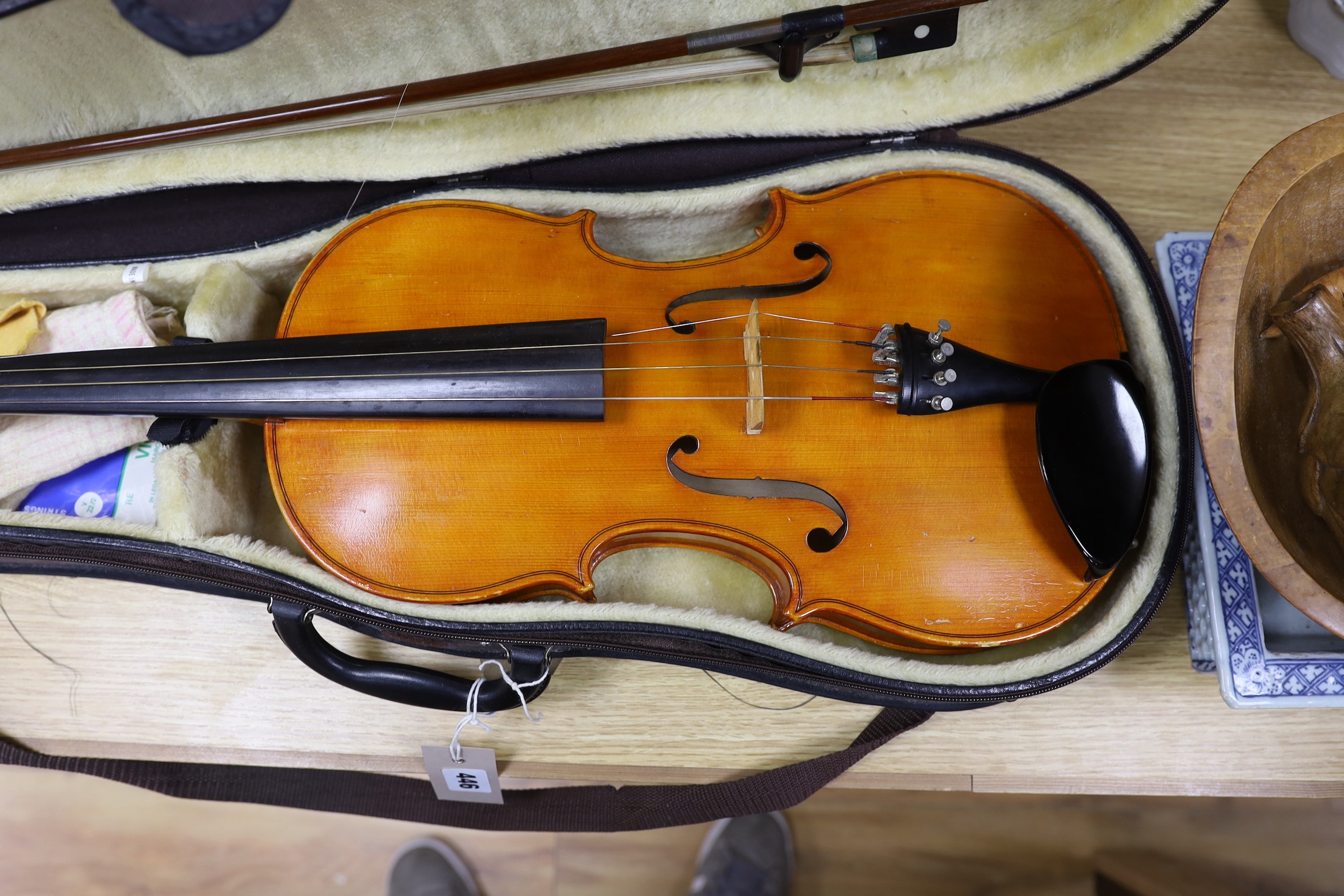 A cased viola crackled glaze, with bow